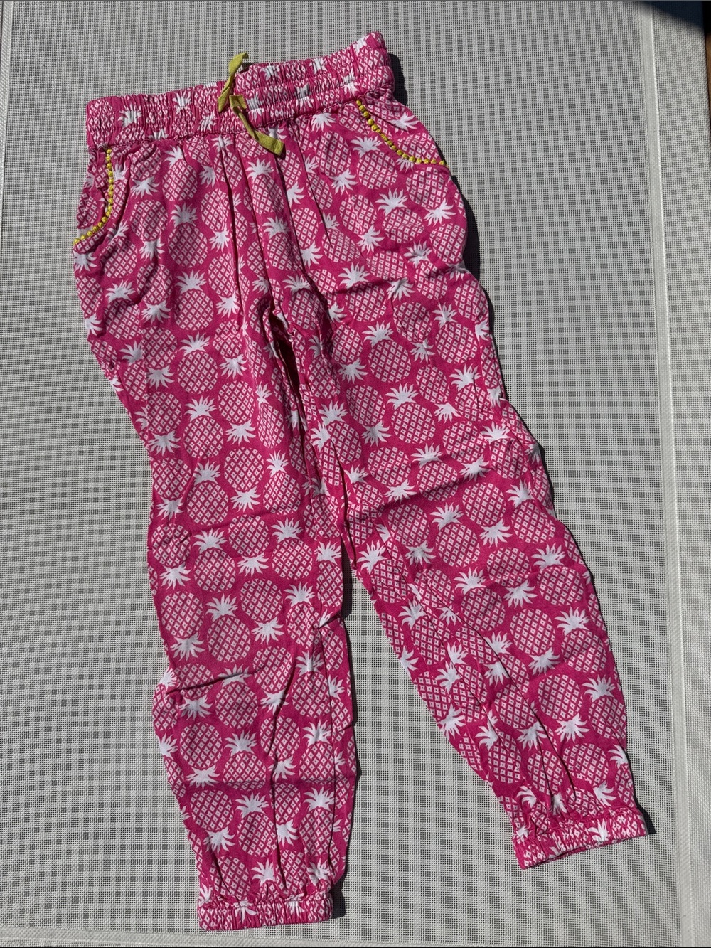 Mini Boden girls’ pink pineapple print joggers